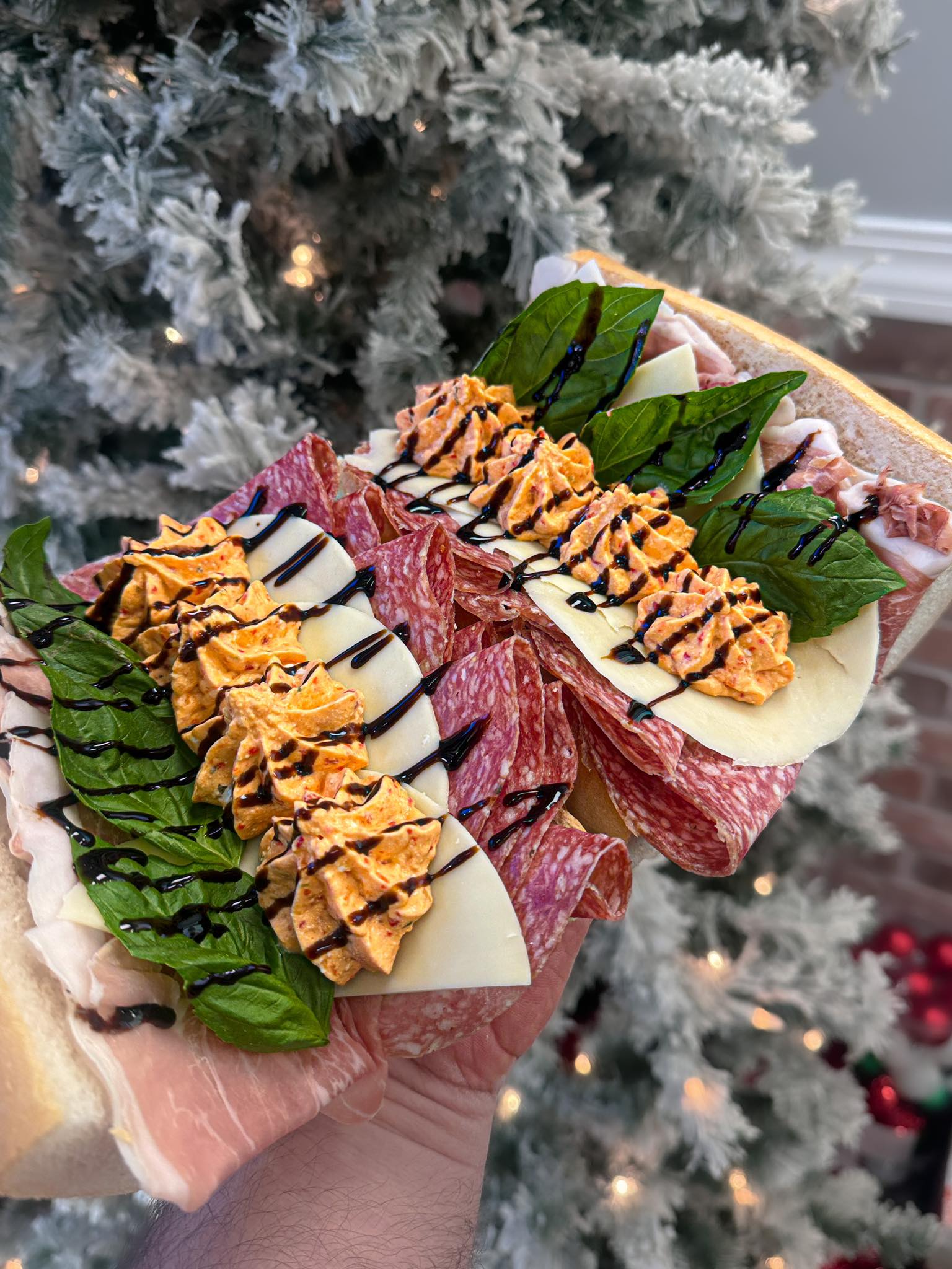 Italian charcuterie platter with cured meats cheese and greens